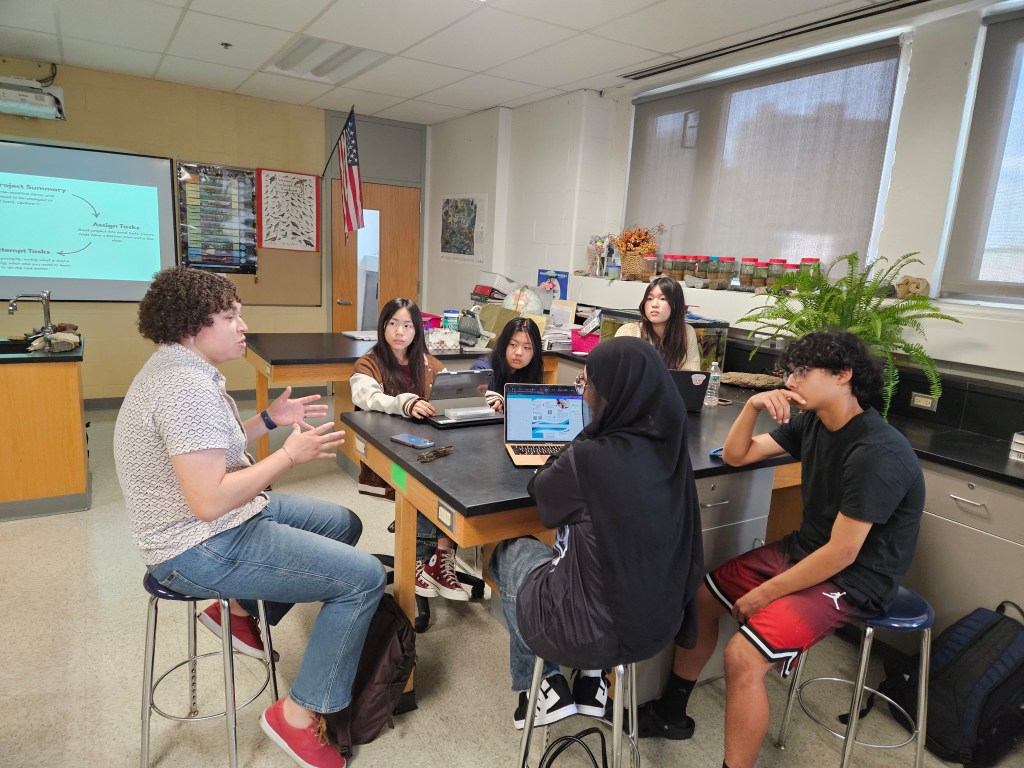 Members refine their project to reduce lead in local drinking water with a city councilor.